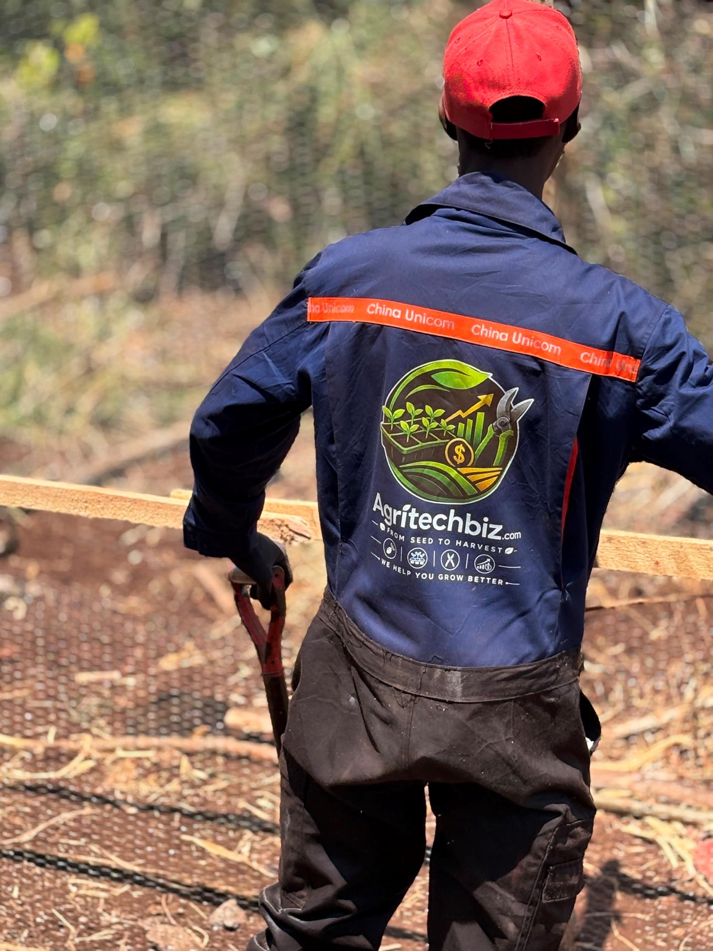AgritechBiz field officer at work on a client farm, where labour and input costs are tracked against returns
